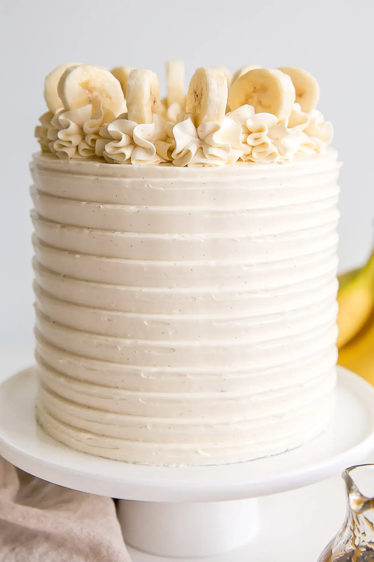 Close up of the front of the cake showing the texture from the cake comb and flecks of vanilla bean.