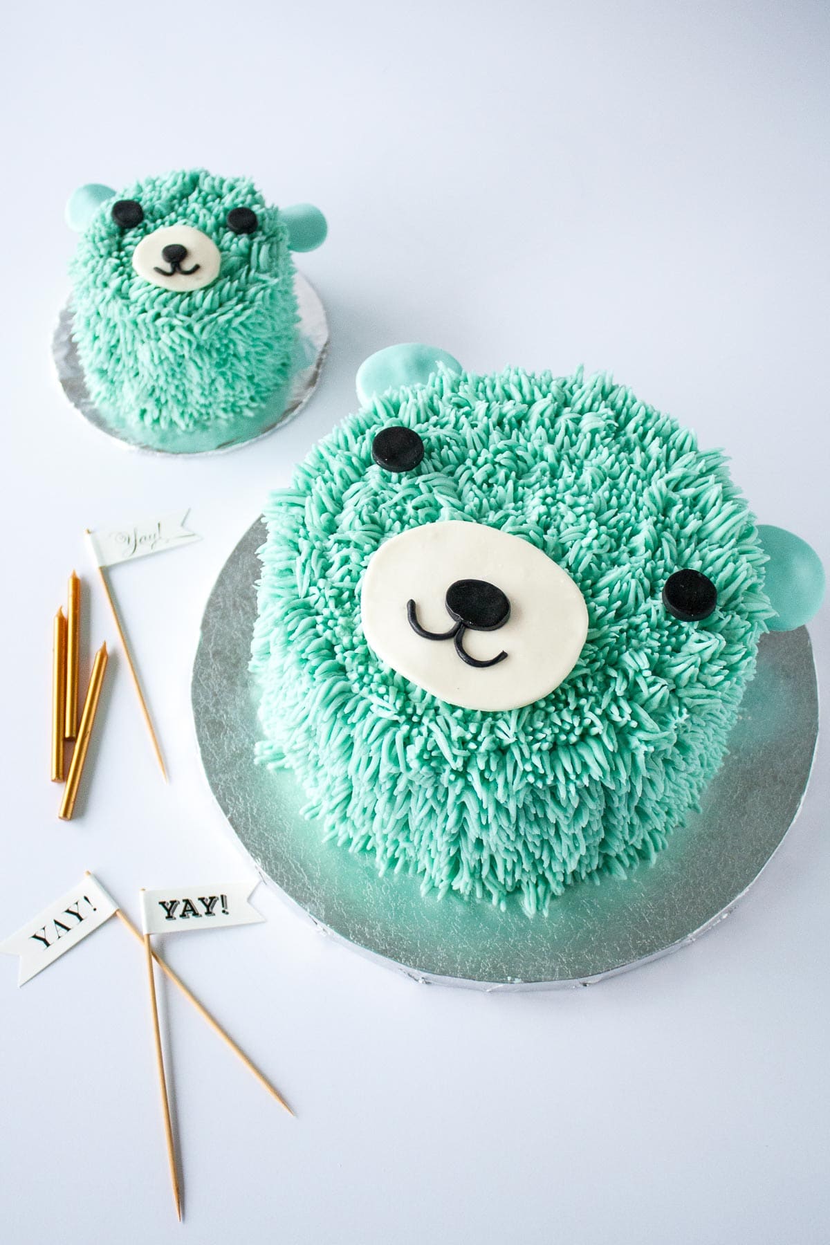 Two blue bear cakes on a white background.