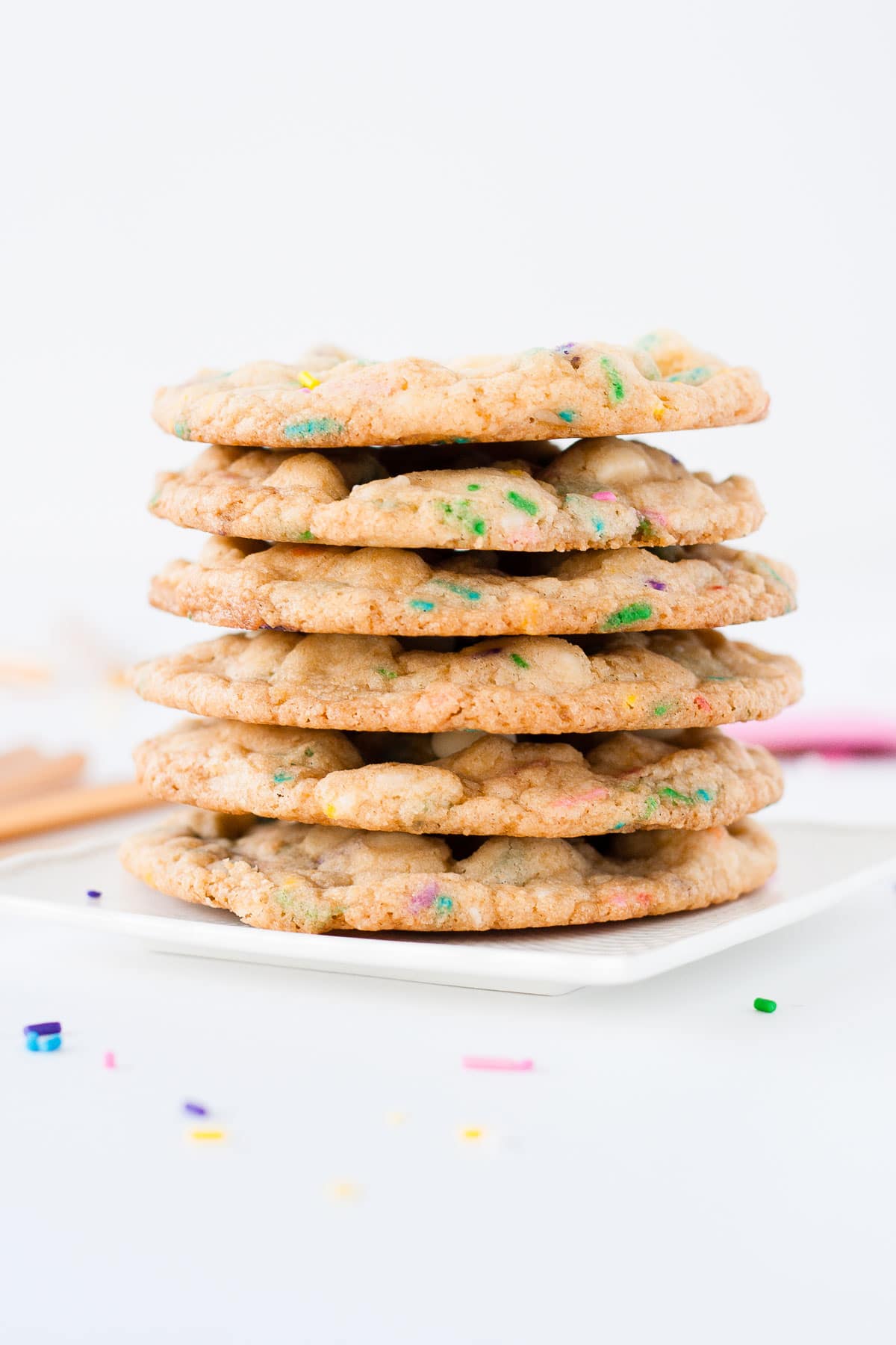 Stack of cookies on a white plate.