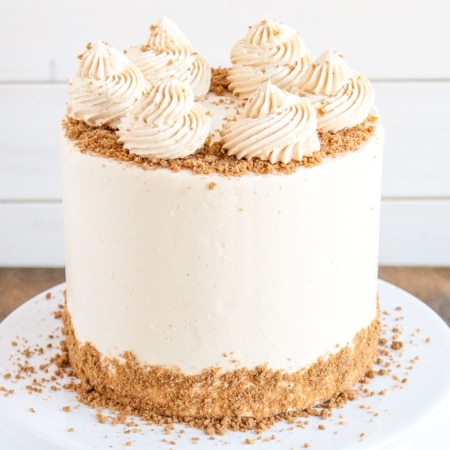 Biscoff cake on a cake stand.