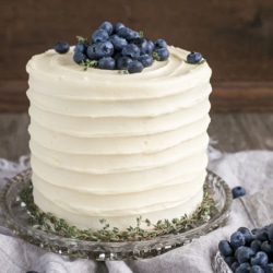 Close up of the cake on a glass cake stand.