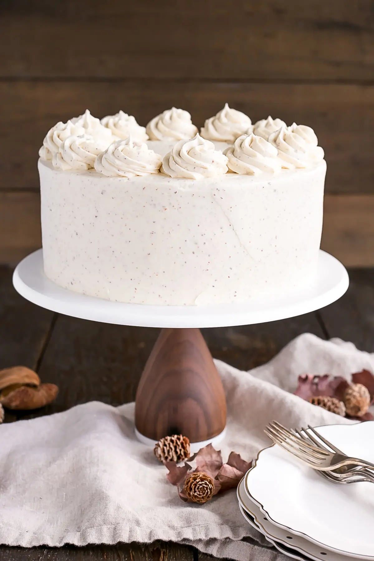 Cake on a cake stand on a wooden table