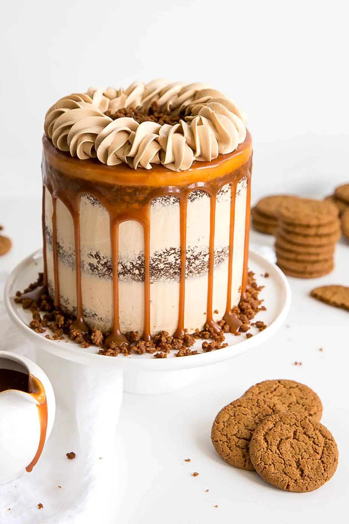 Caramel Gingerbread Cake decorated naked cake style with a caramel drip and rope border on top.