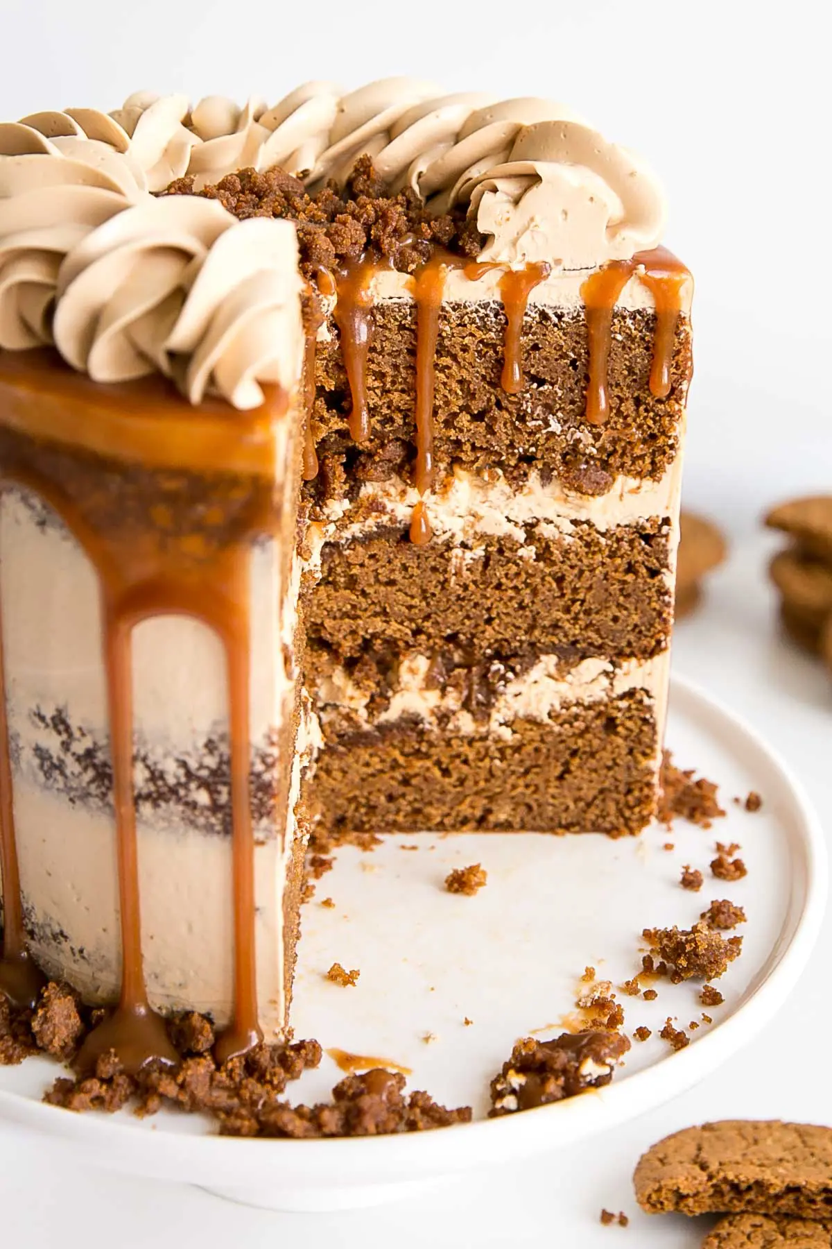 Cross section showing gingerbread cake layers, caramel buttercream and gingerbread streusel.