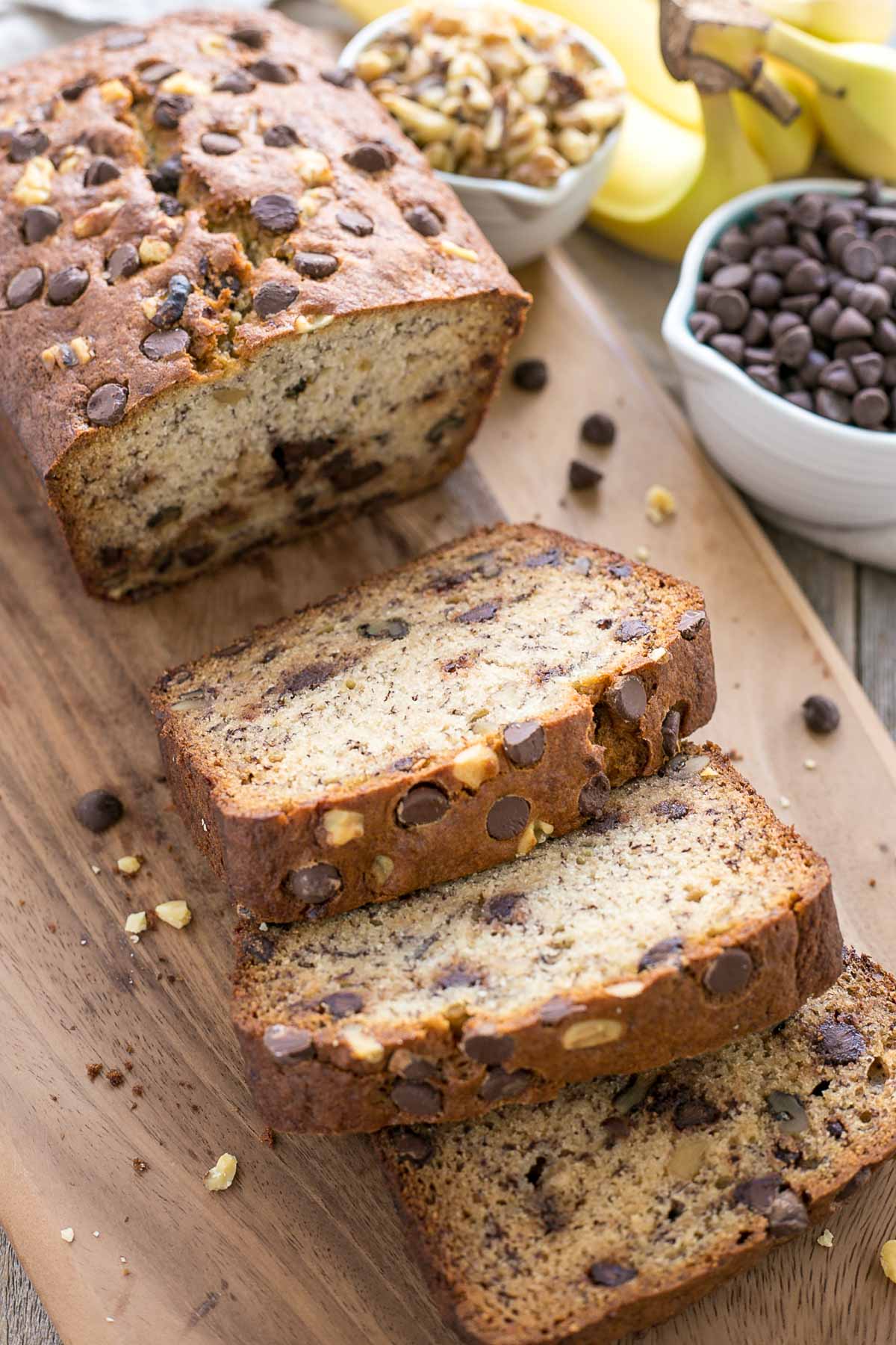 Angled shot of Banana bread slices on a cutting board.