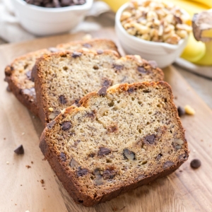 Banana bread slices on a cutting board.