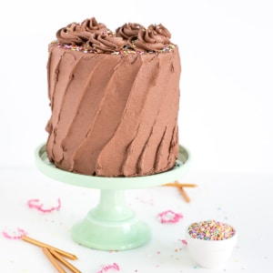 A chocolate covered cake on a table