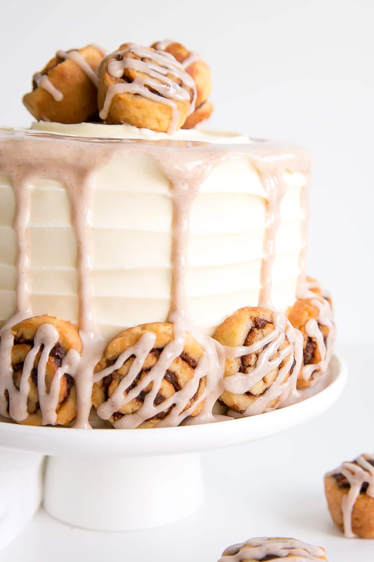 Close up of side of the cake showing rustic frosting and glaze.