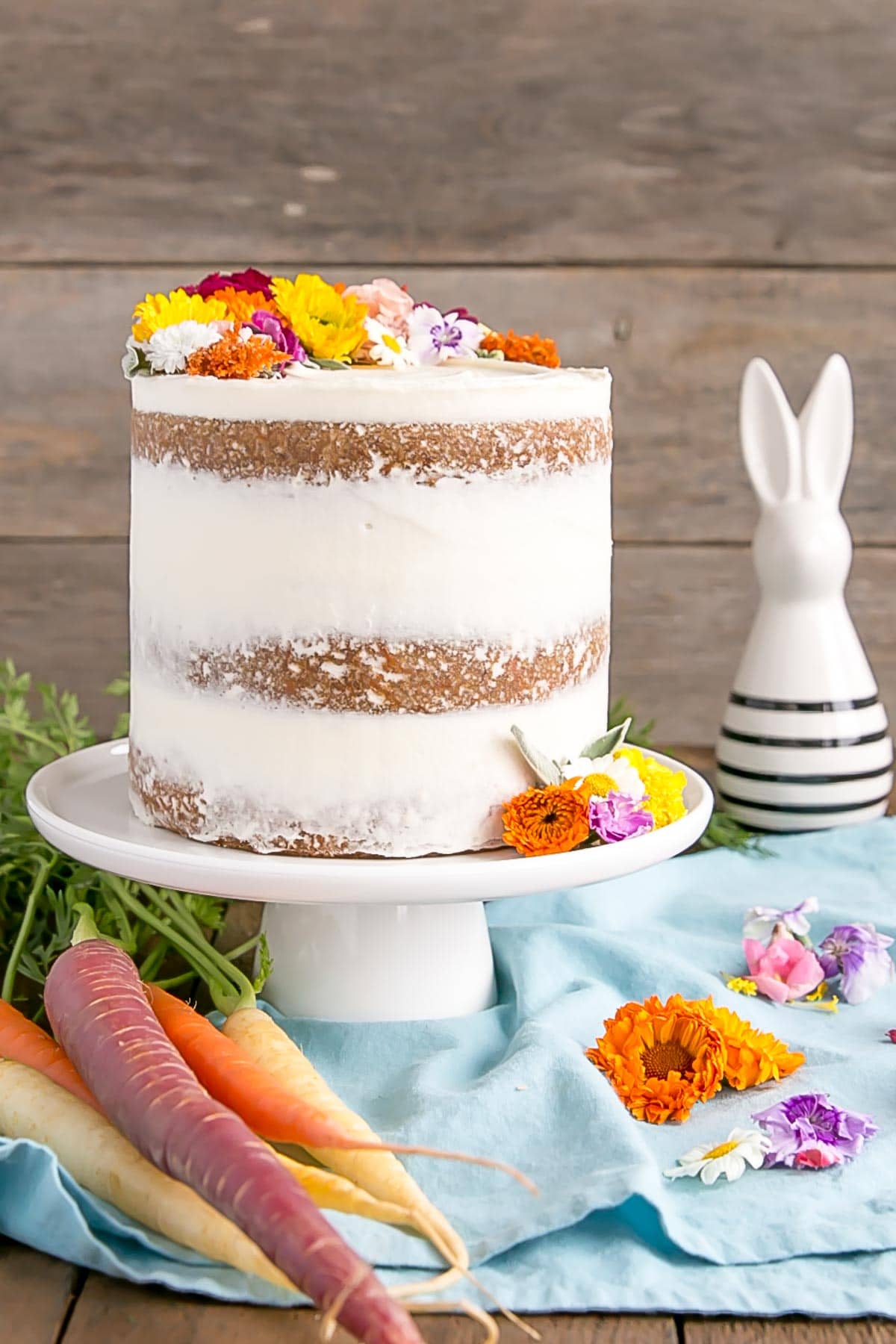 Carrot Cake recipe with cream cheese frosting and edible flowers