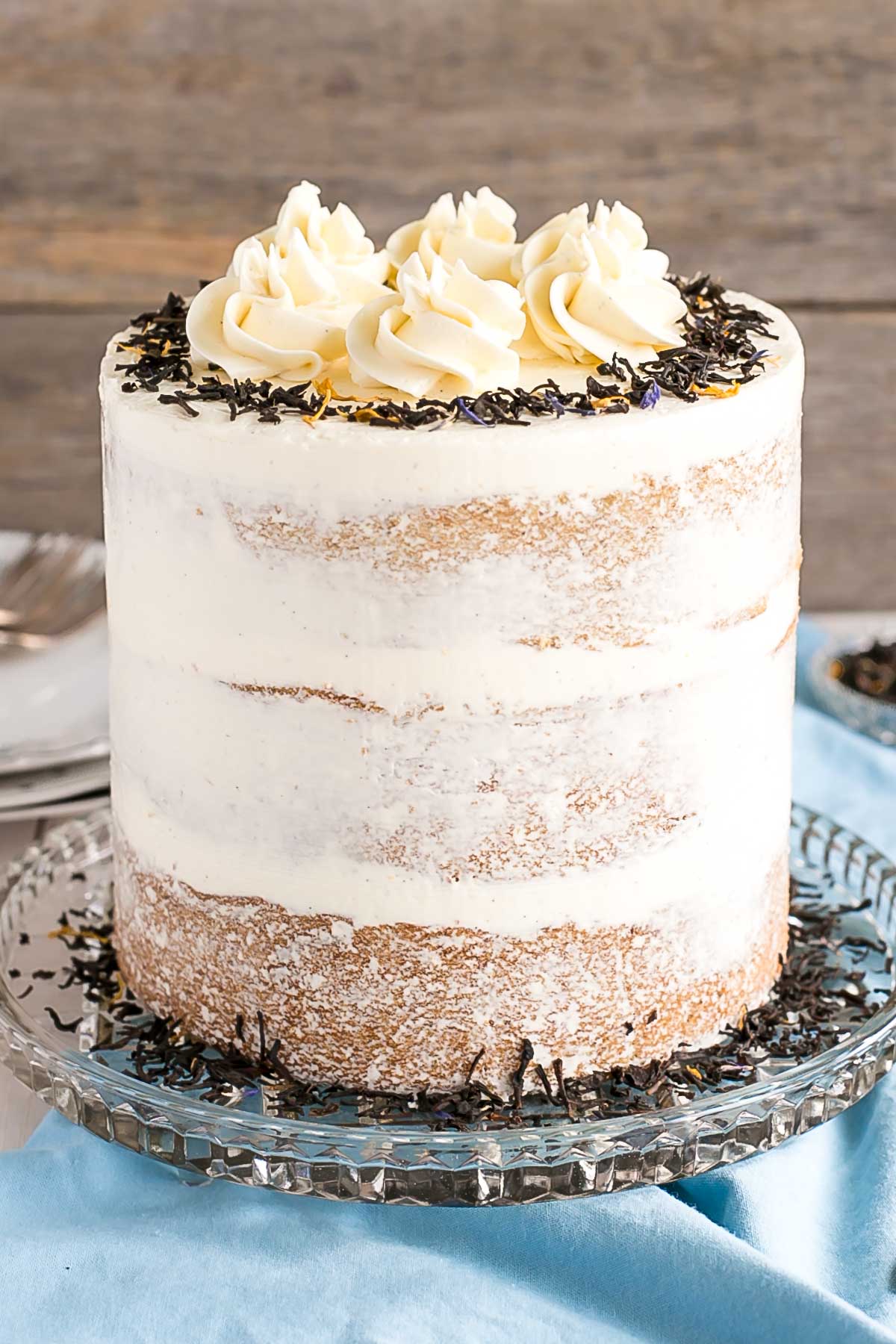 Cake on a clear glass cake stand.