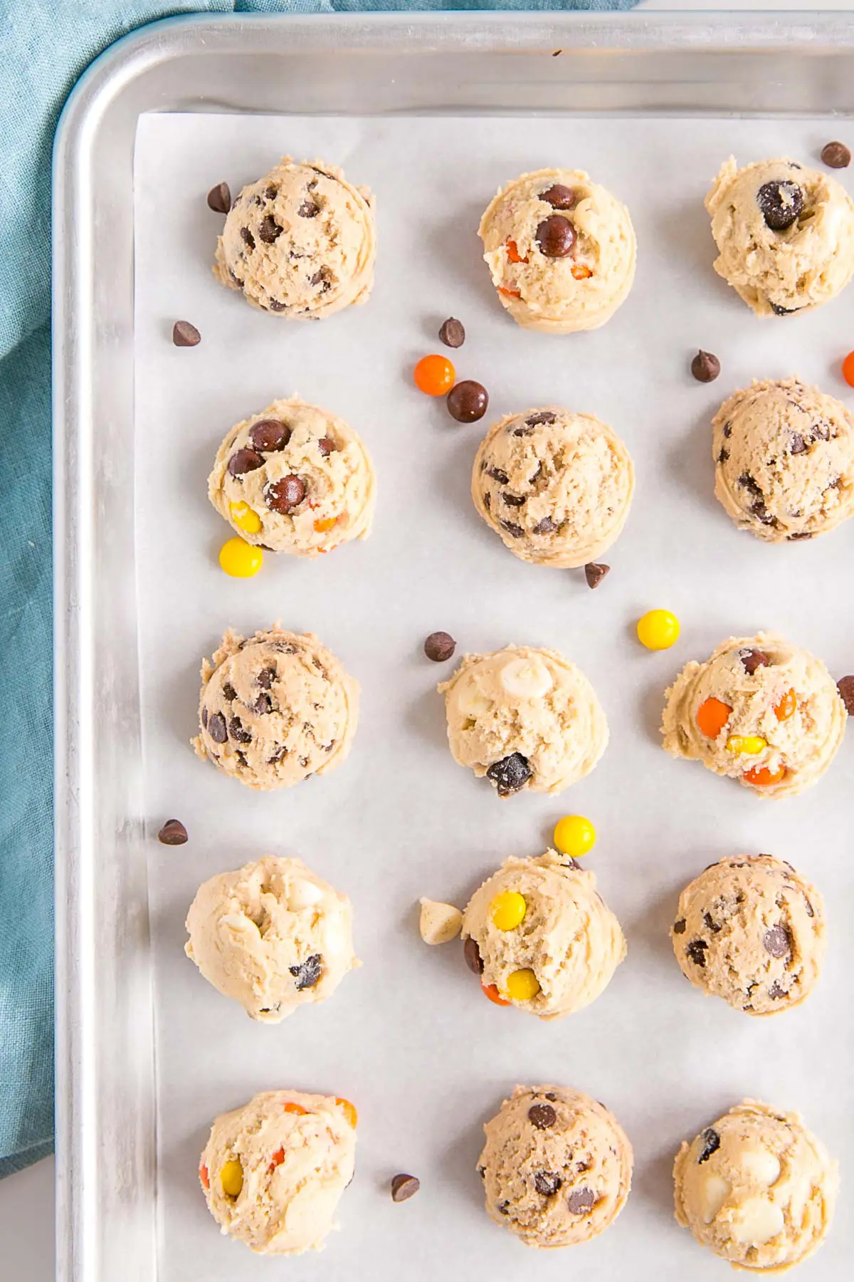 Portioned balls of dough on a baking sheet ready for the freezer.