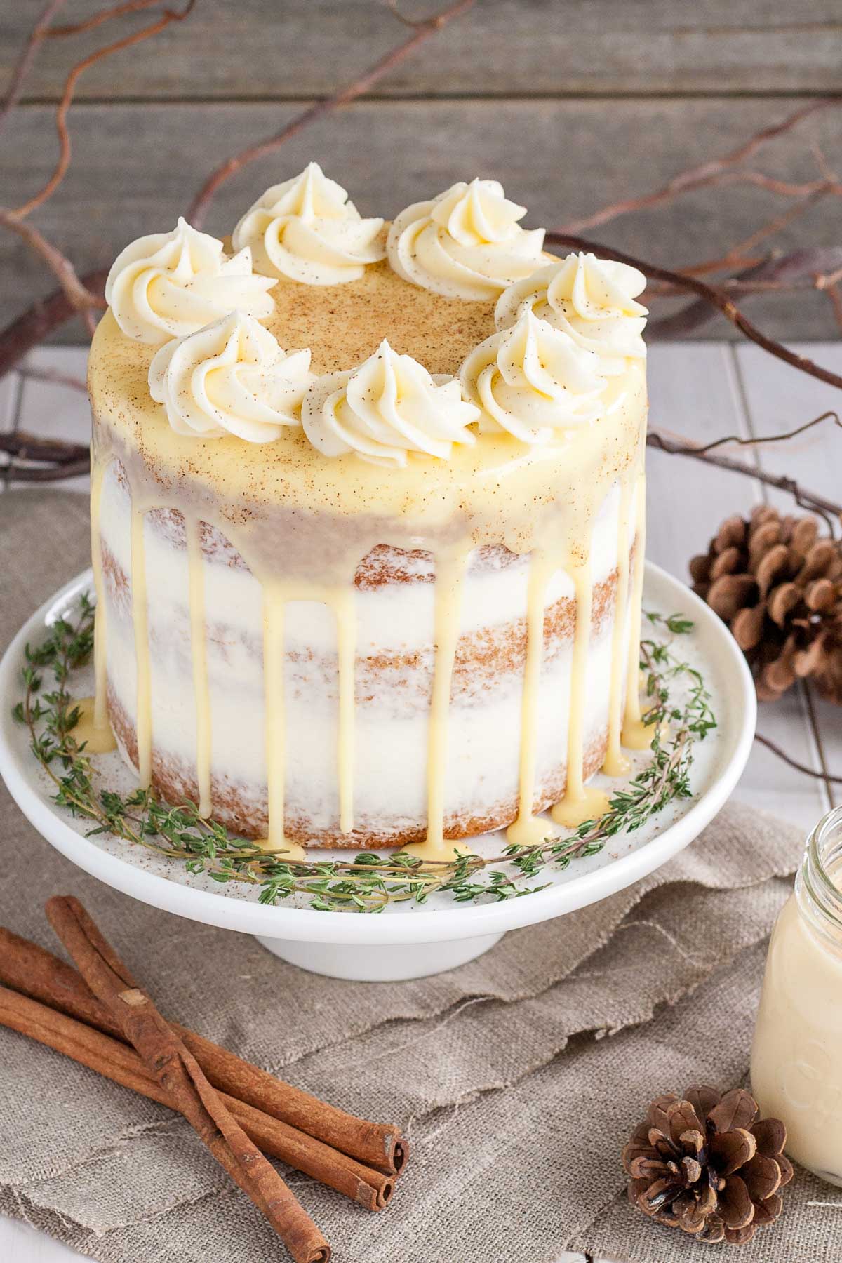 Eggnog cake with rum simple syrup and cream cheese frosting.