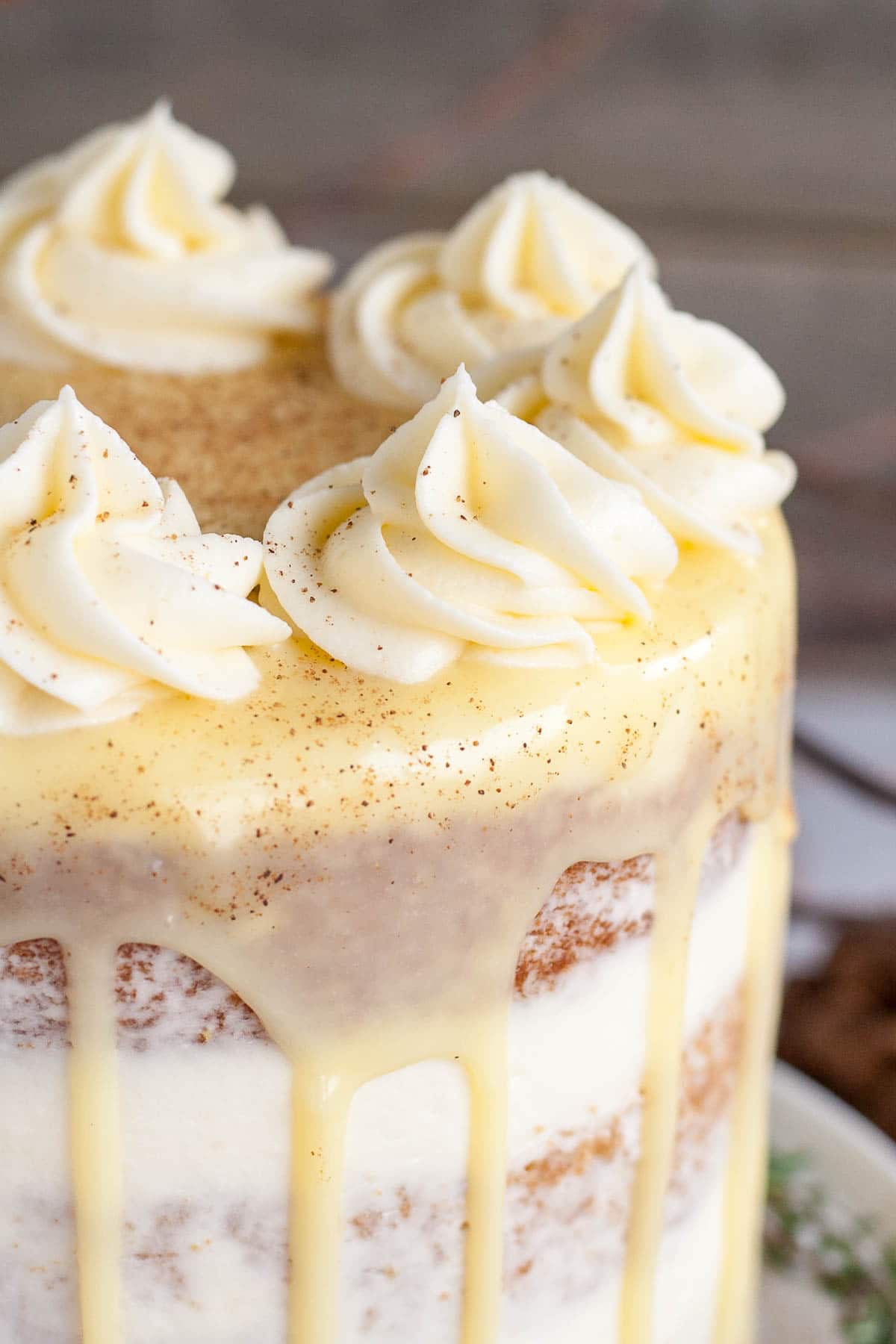 Close up of rosettes on an eggnog cake.