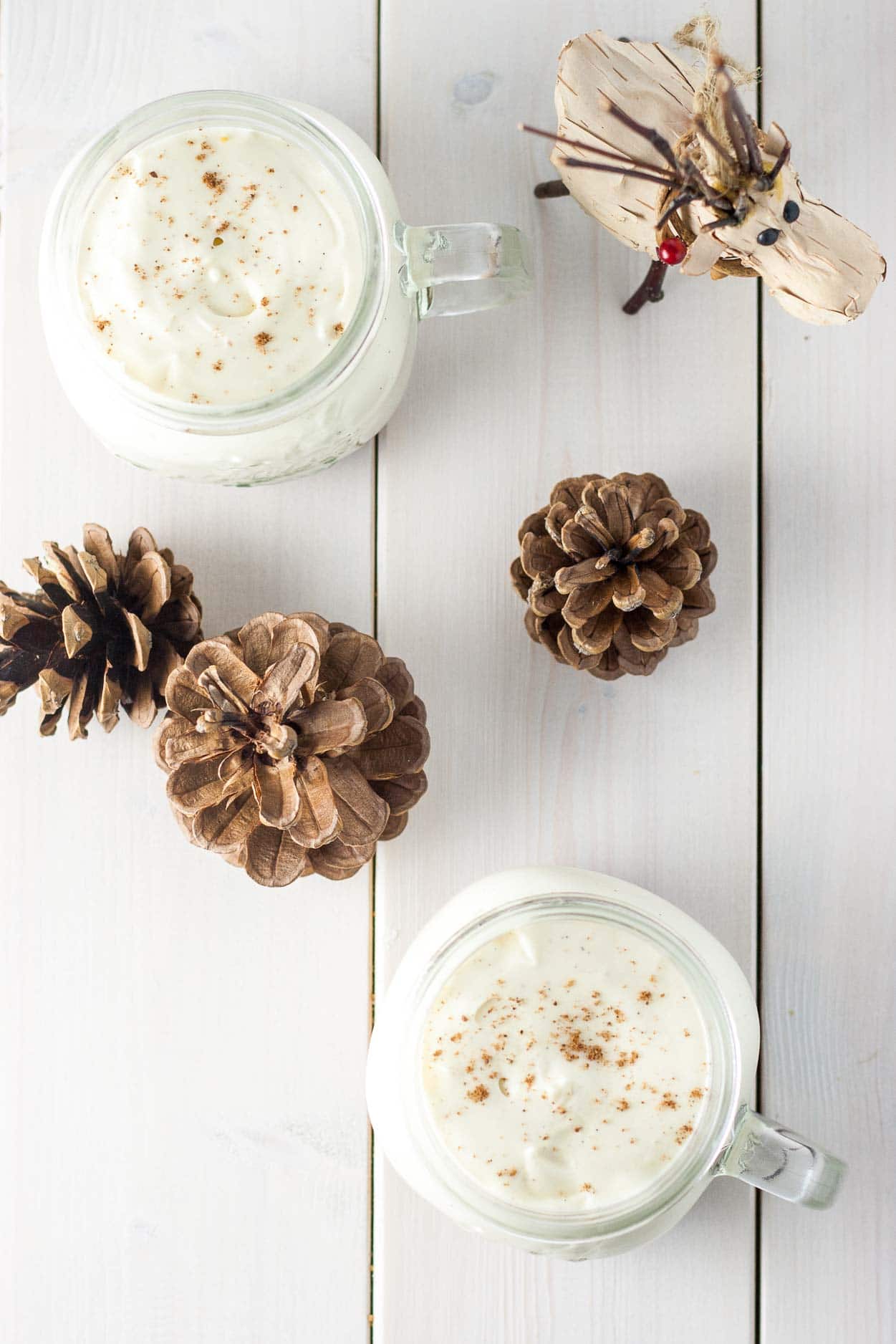 Overhead shot of eggnog mousse in jars.