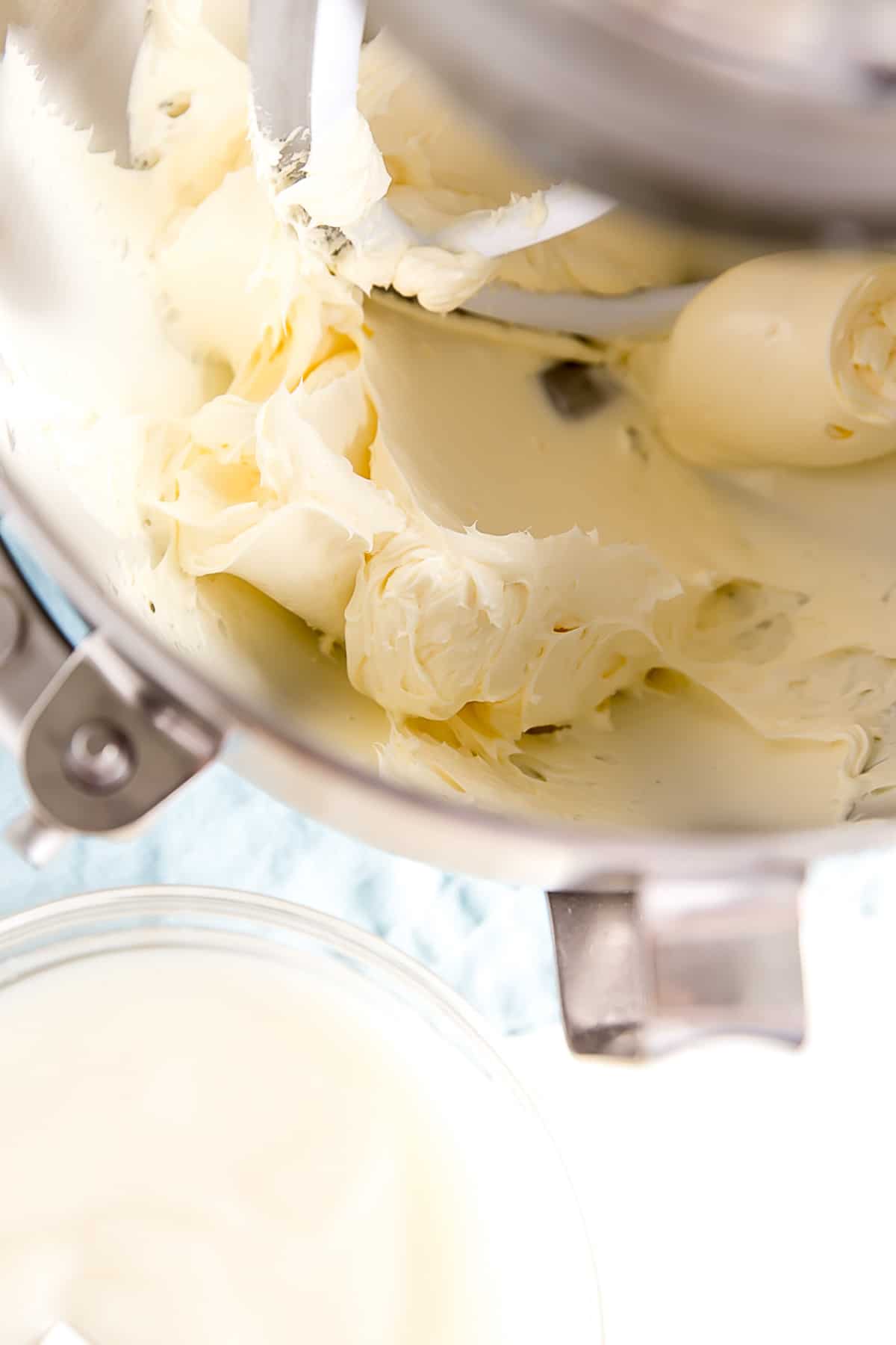 Creamed butter in the bowl of a stand mixer.