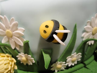 A close up of a fondant bee