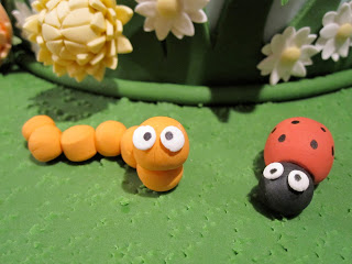 Close up of a fondant caterpillar and ladybug