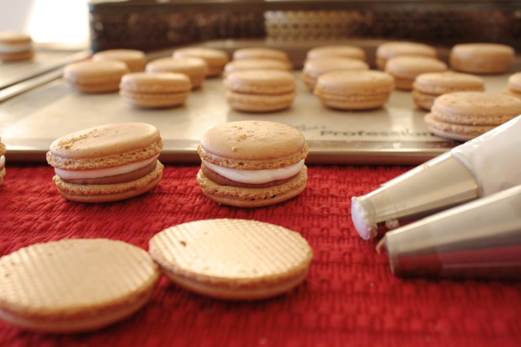 Shells being filled with ganache and marshmallow fluff.