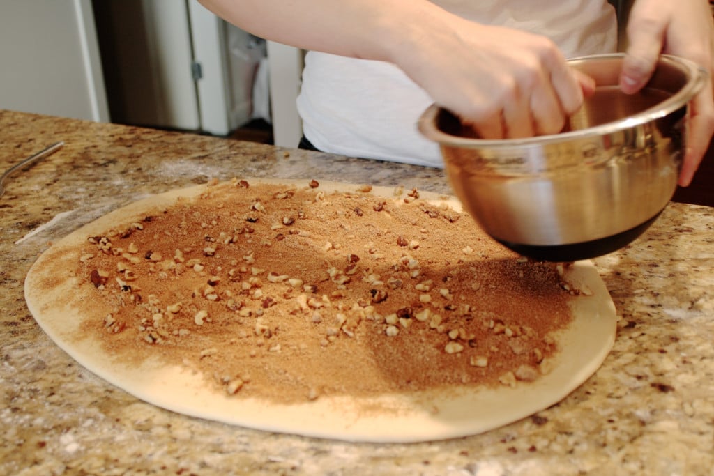 Sprinkle cinnamon sugar and nuts onto the dough