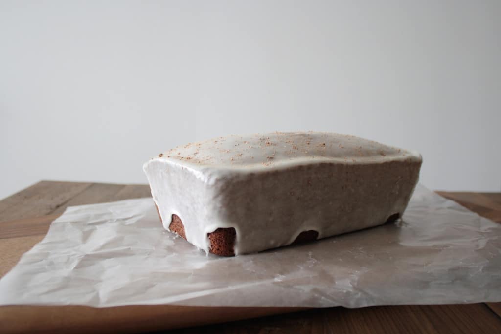 Glazed loaf on a cooling rack.