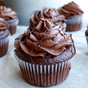 Chocolate cupcakes on a table.