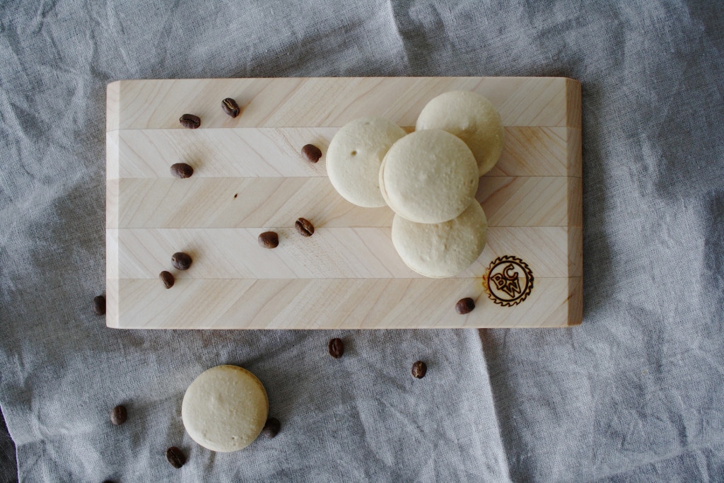 Macarons on a cutting board.