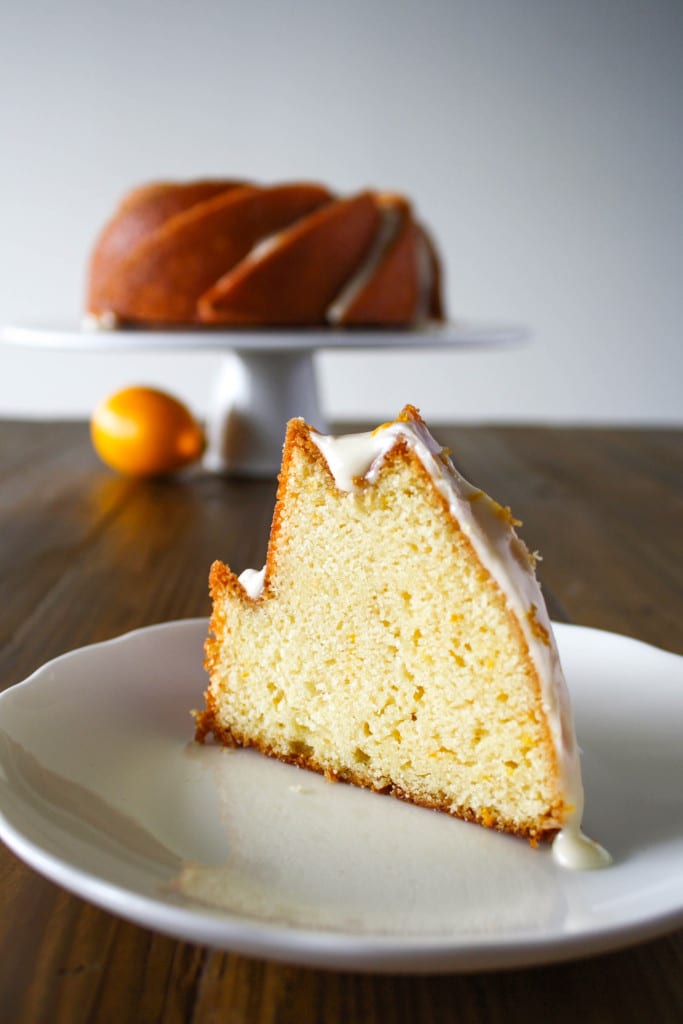 Bundt cake slice with cake in the distance.