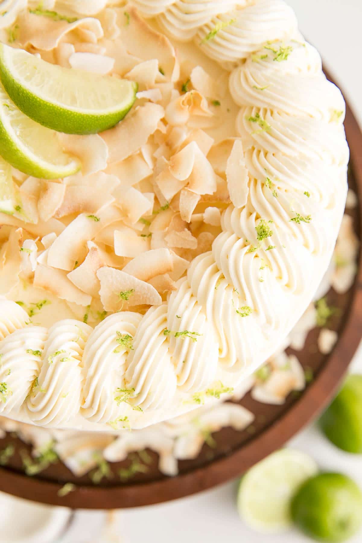 Buttercream rope border decorates the top of this coconut lime cake.