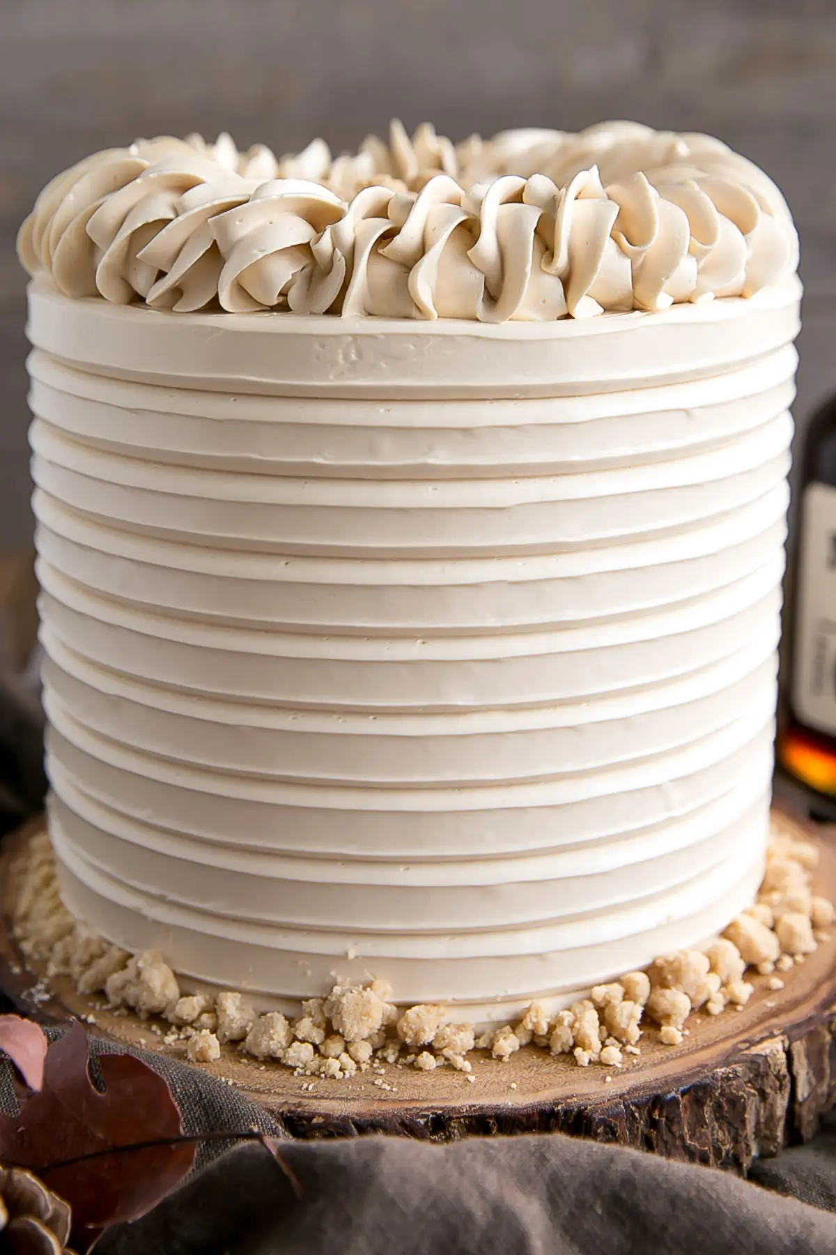 Close up of Maple Cake showing textured frosting and rope border.