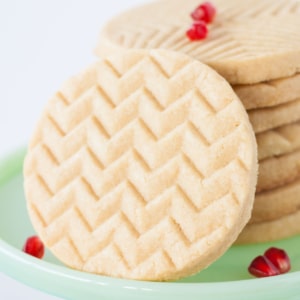 Close up of cookies on a green cake stand.