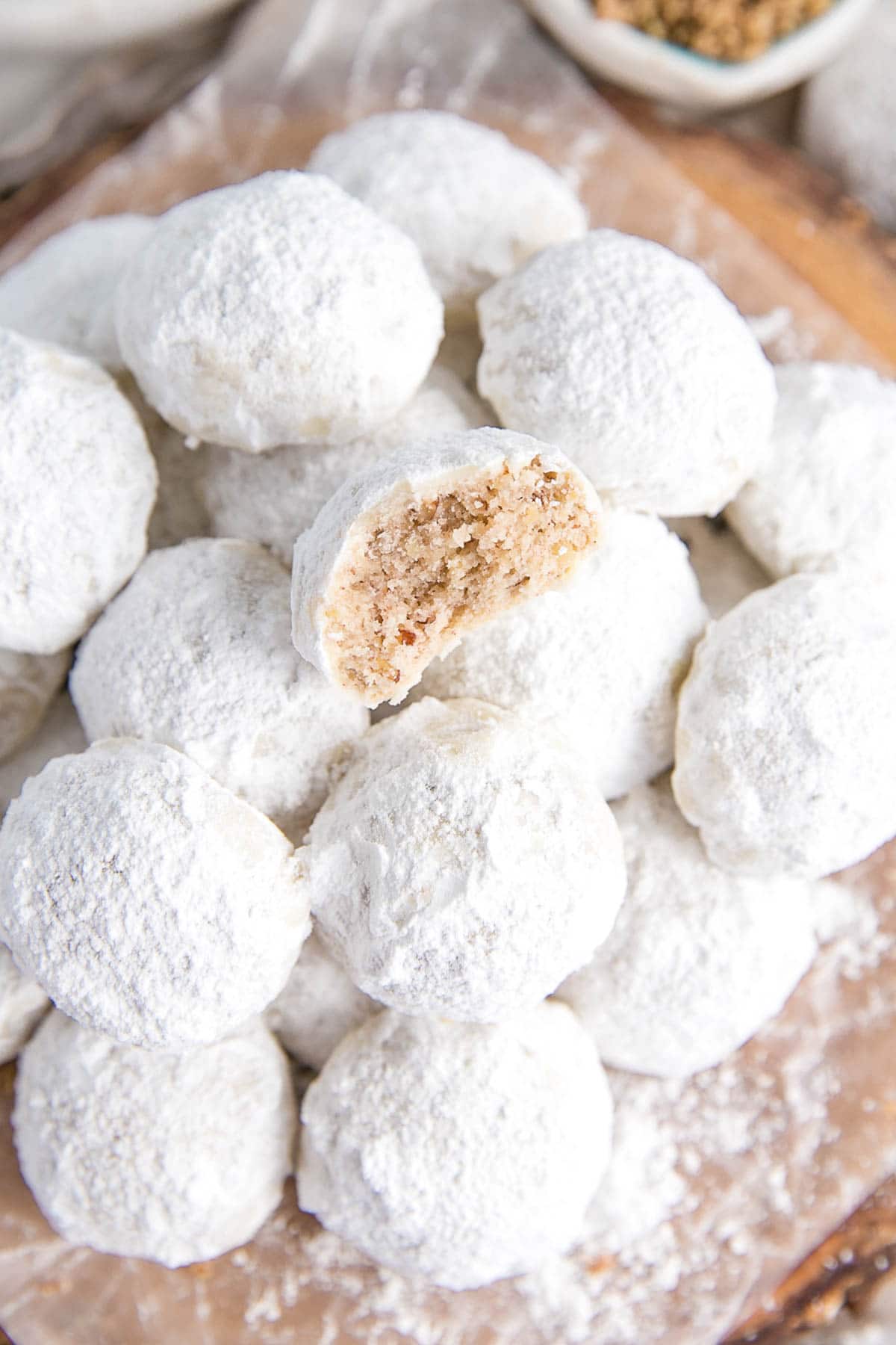 Pecan butter cookies dusted with powdered sugar.