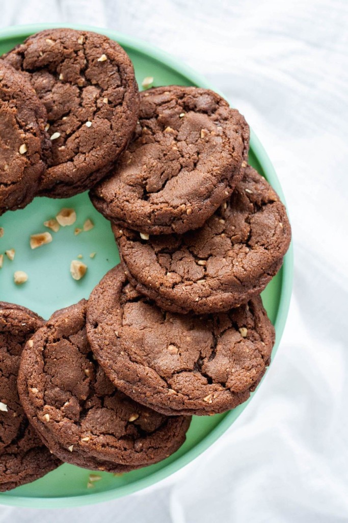 Overhead shot of cookies on a green cake stand.