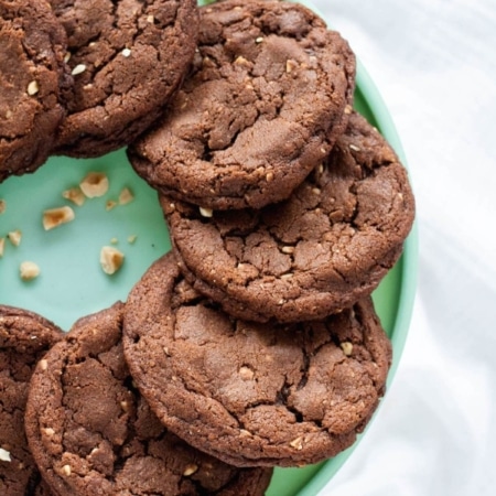 Overhead shot of cookies on a green cake stand.