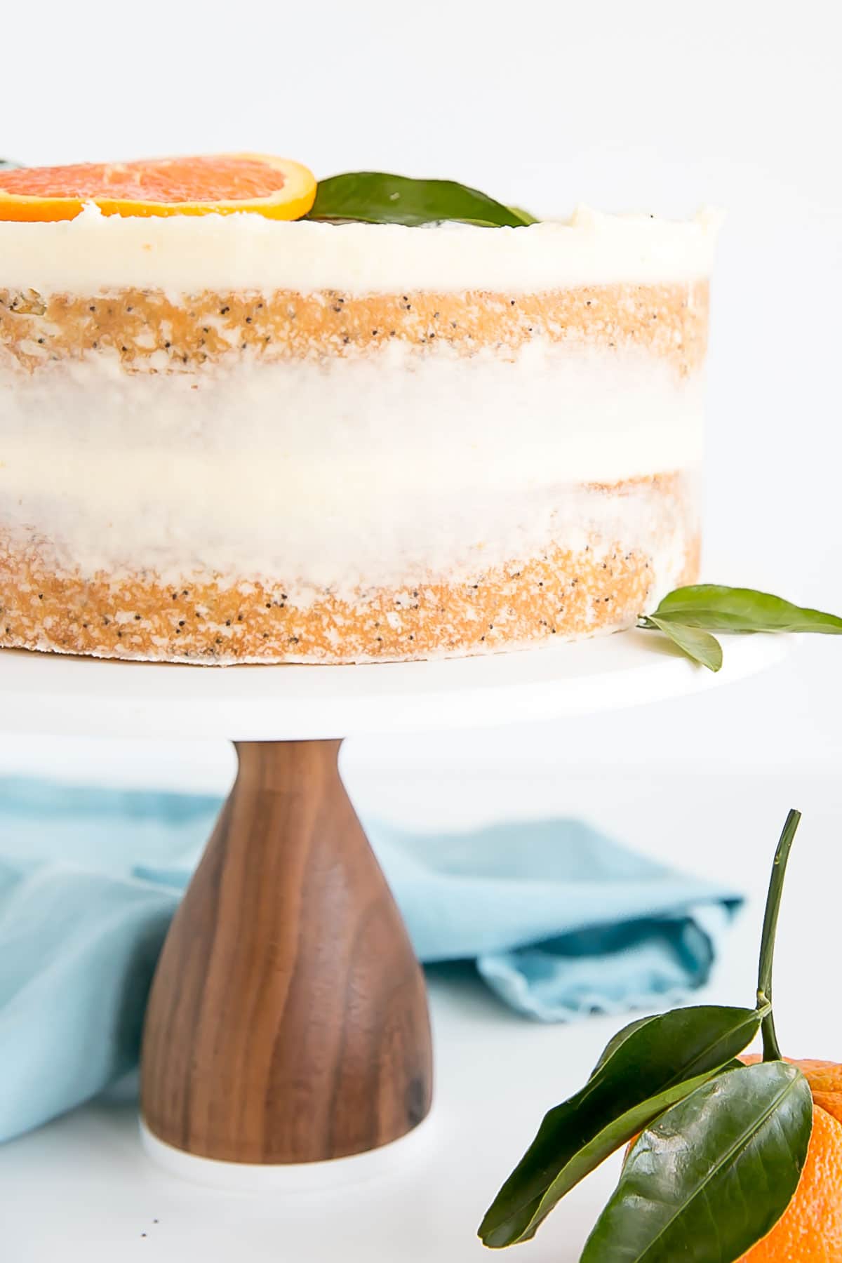 Close up of side of orange poppy seed cake layers 