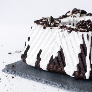 Square bundt cake on a slate plate on a white background.