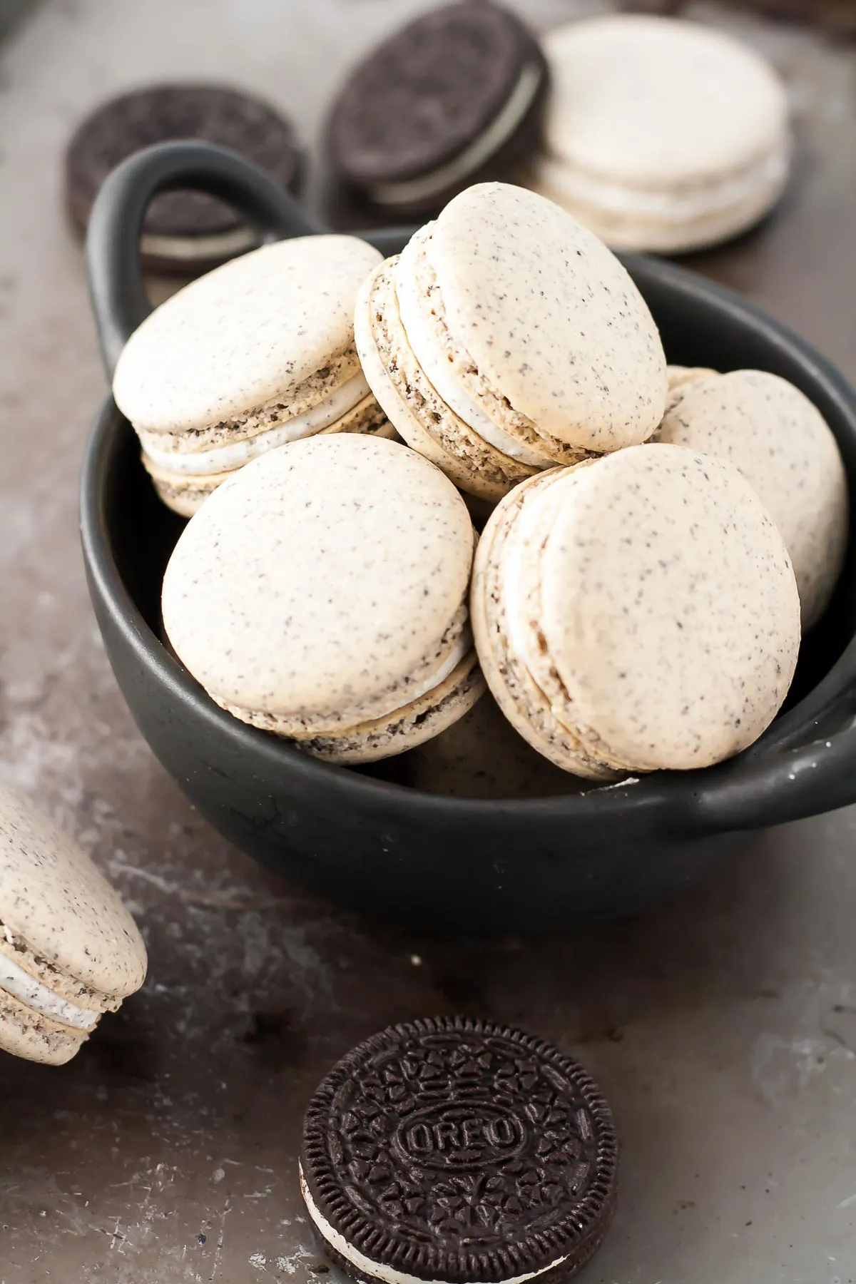 Close up of macarons in a bowl.