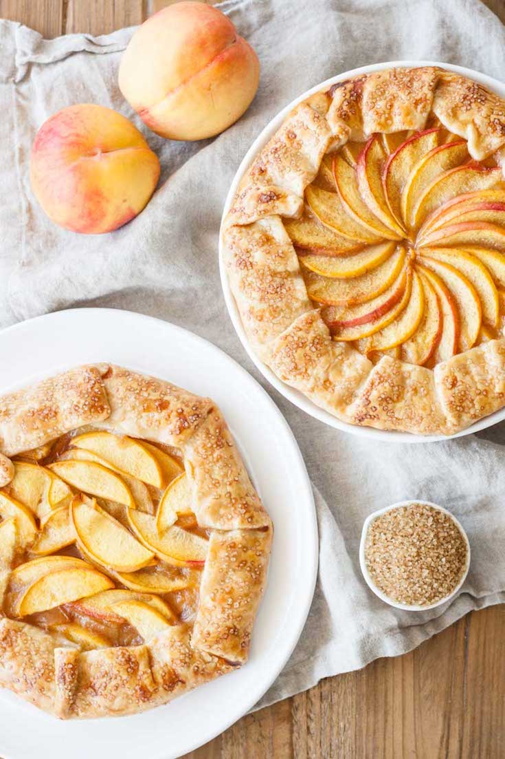 Overhead shot of the two galettes with peaches next to them.