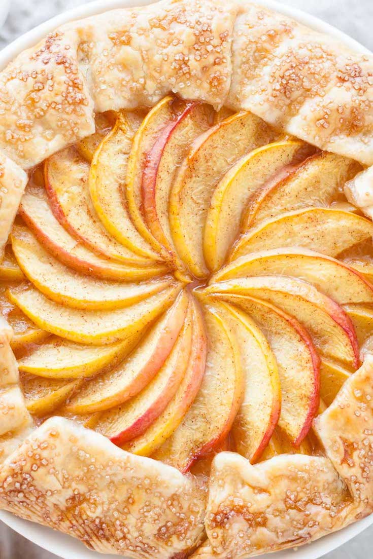 Close up of the pattern of slices peaches in the middle of the galette.