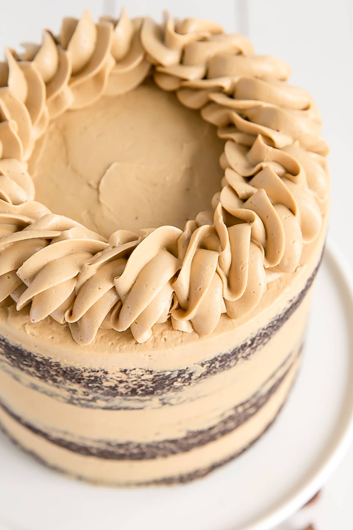 Chocolate Cake with peanut butter frosting. Decorative rope border on top.