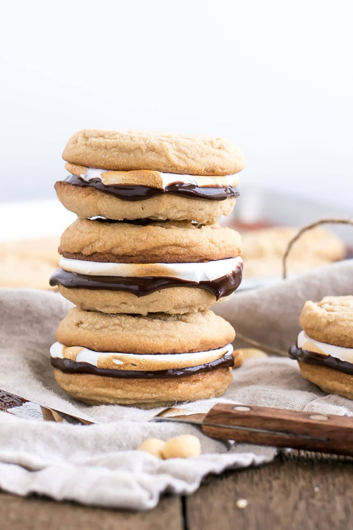 Three sandwiched cookies stacked.