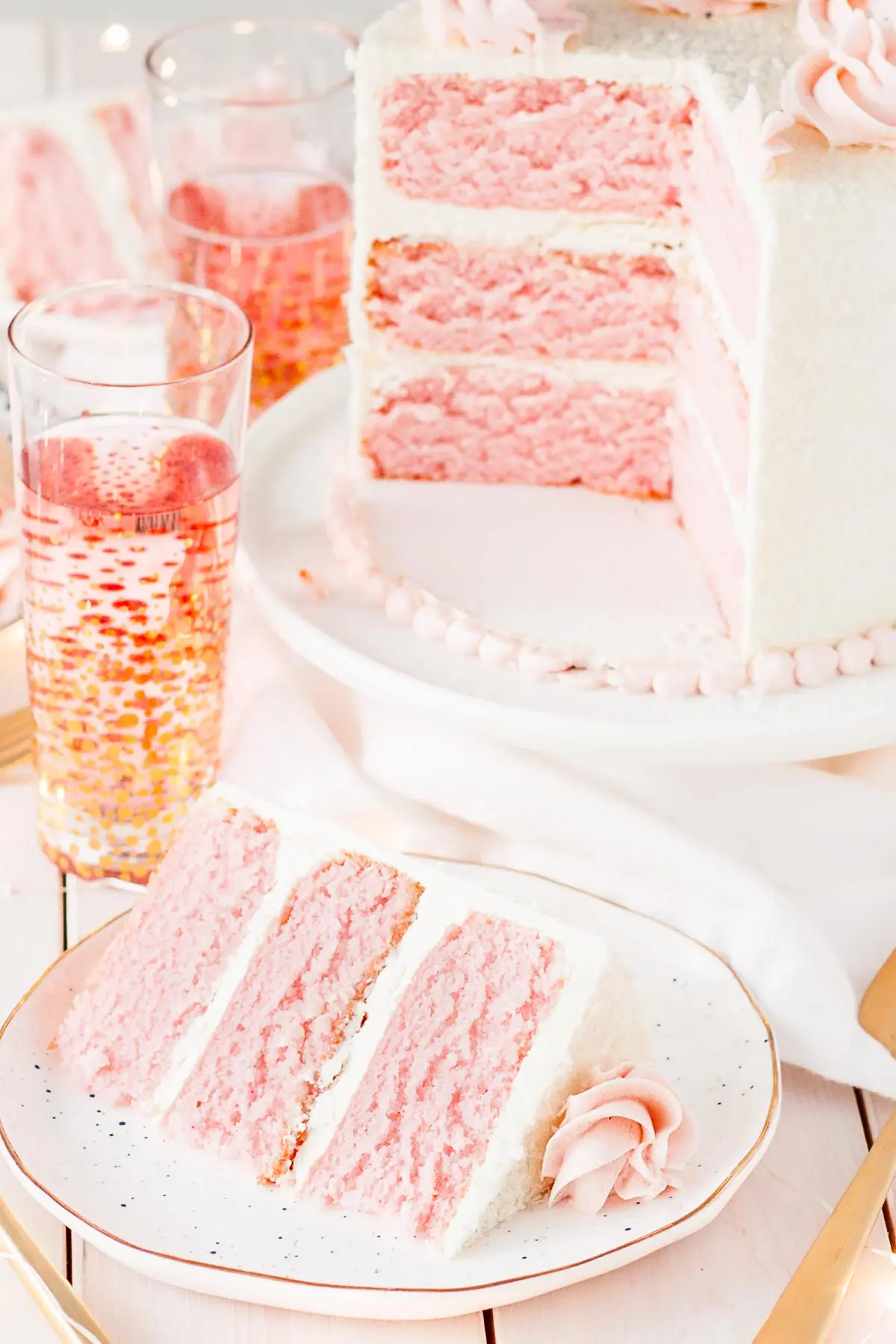 Three layers of Pink Champagne Cake with vanilla swiss meringue buttercream.