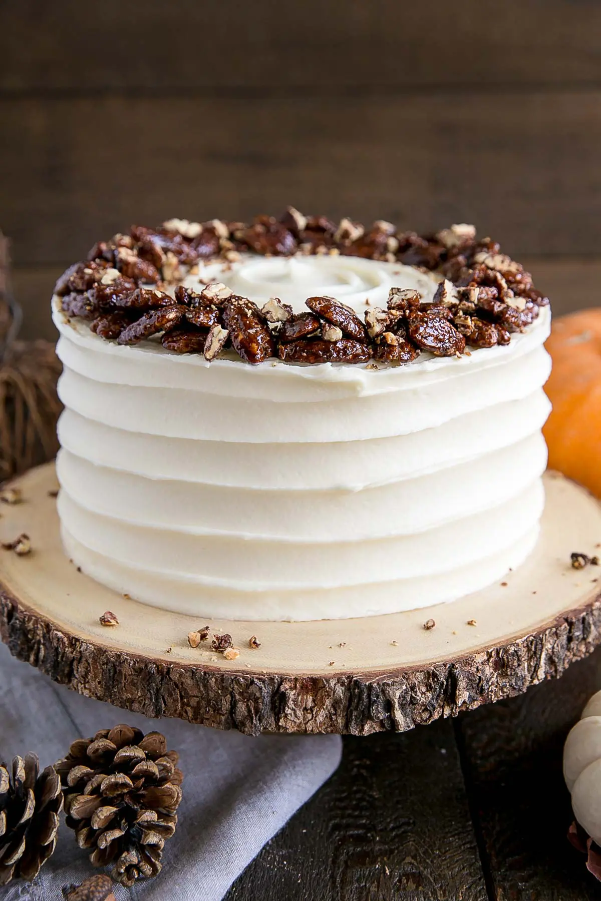 Glossy candied pecans on top of the cake.