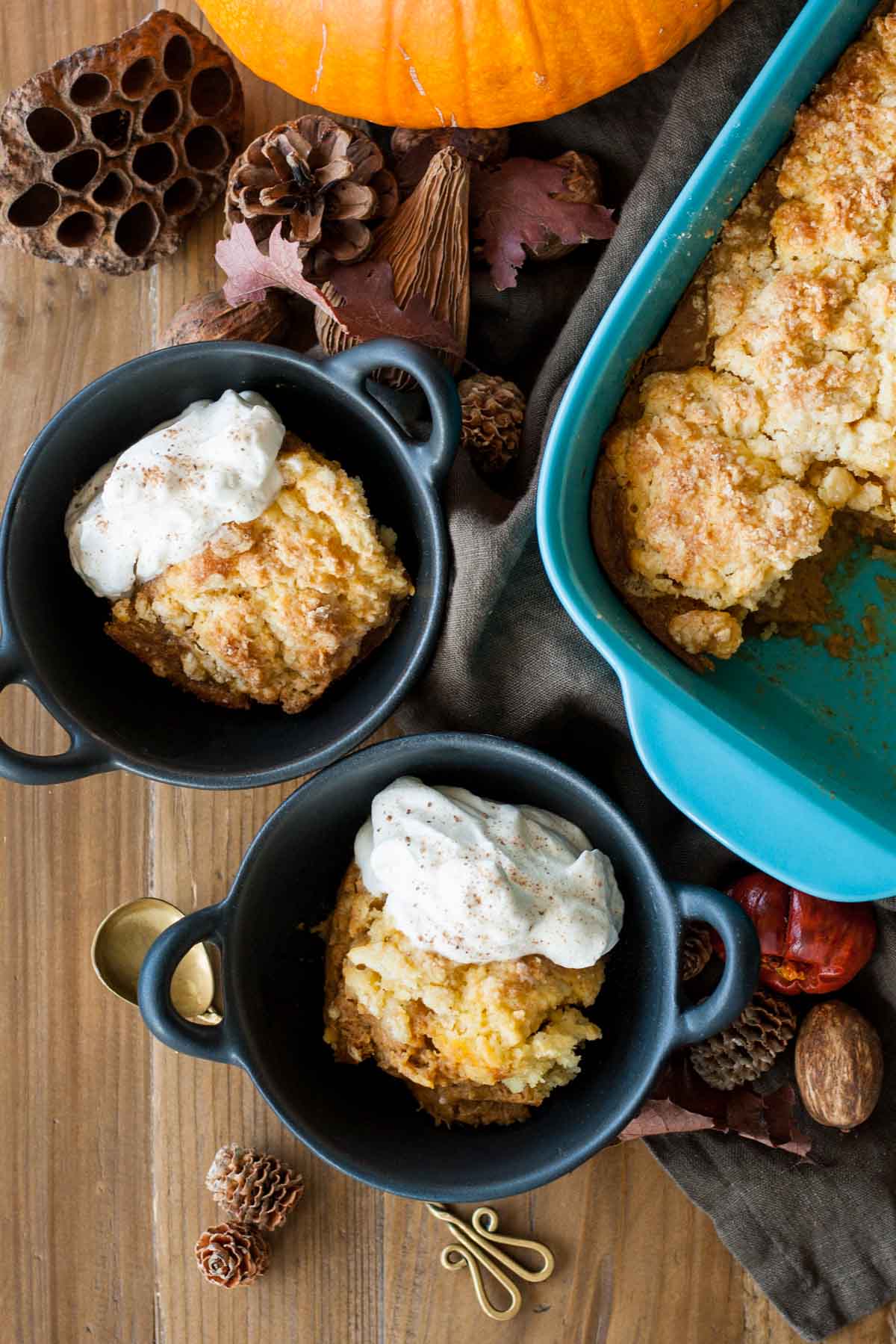 Overhead shot of cobbler spooned into small cast iron bowls.