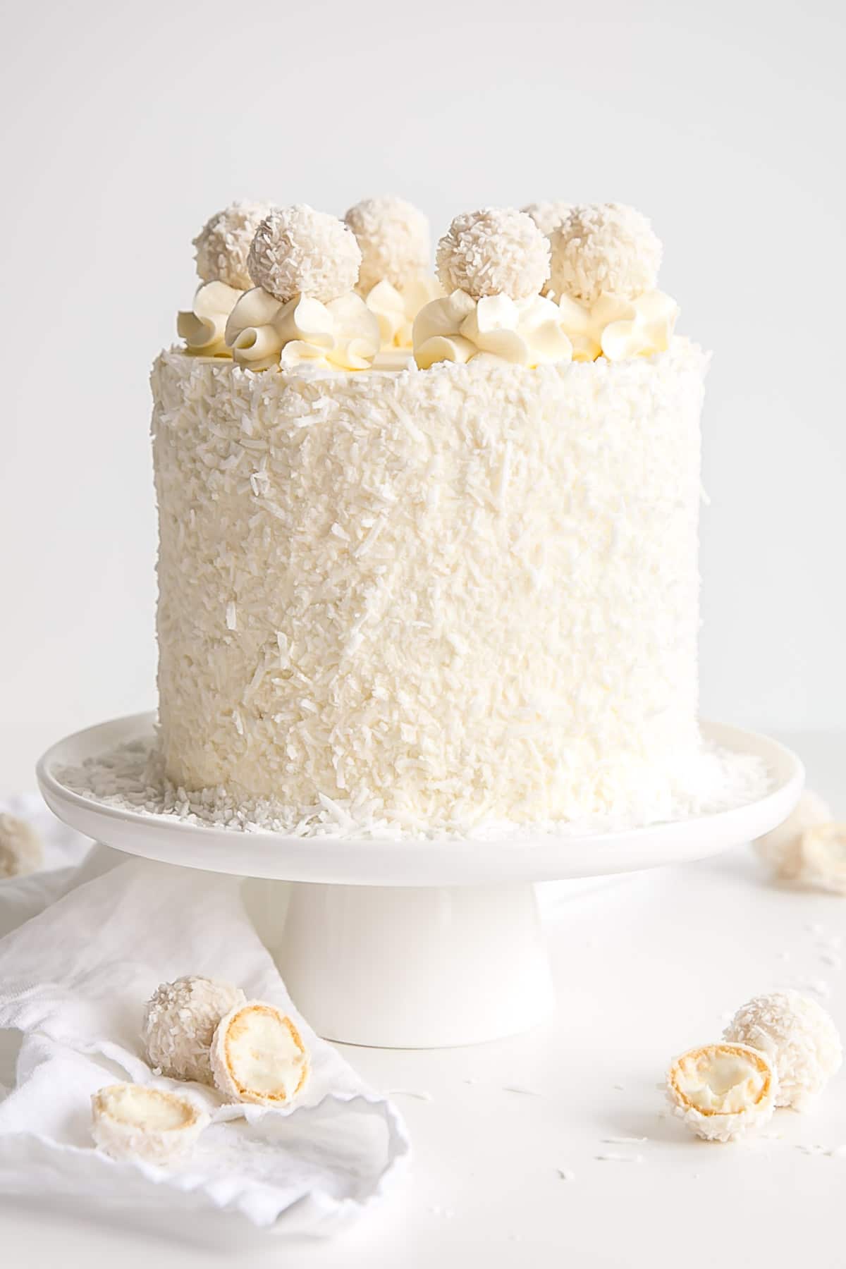 Coconut Almond Cake covered with shredded coconut.