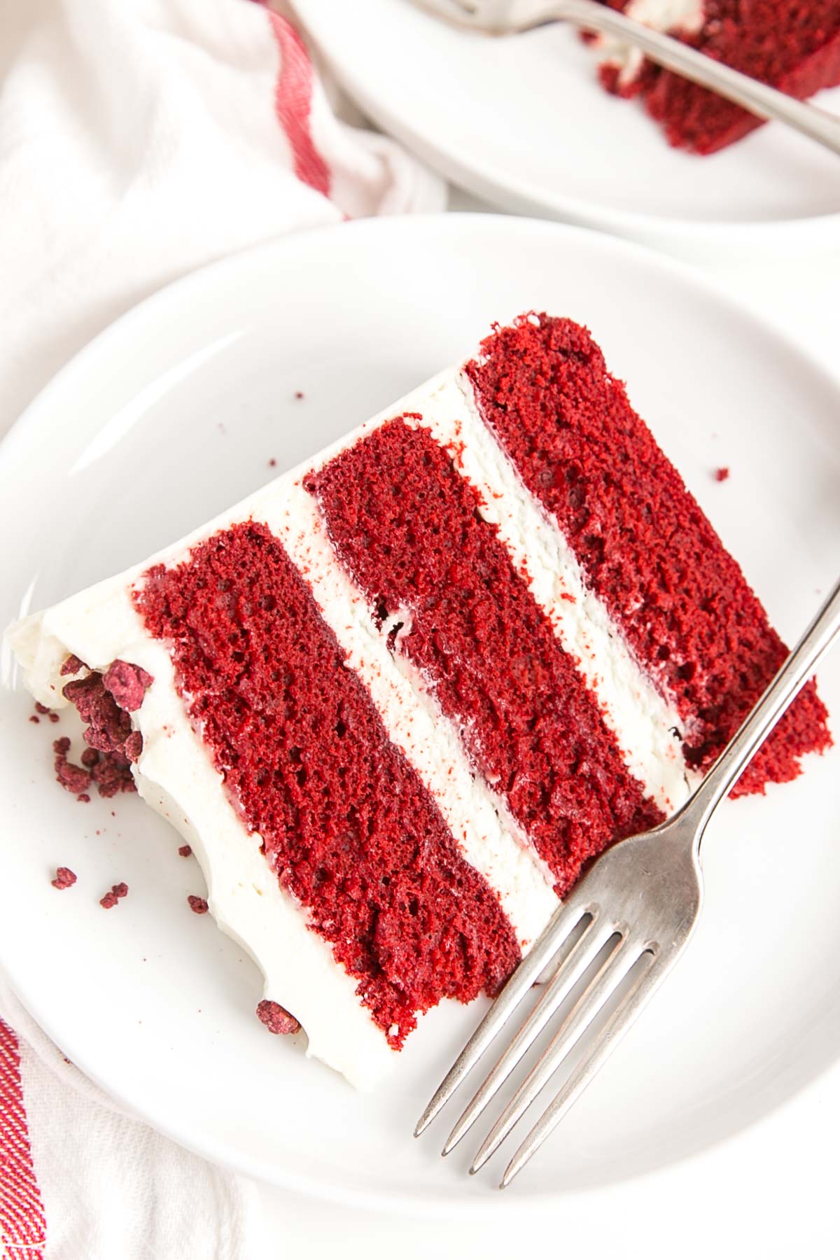 Slice of red velvet cake on a plate.