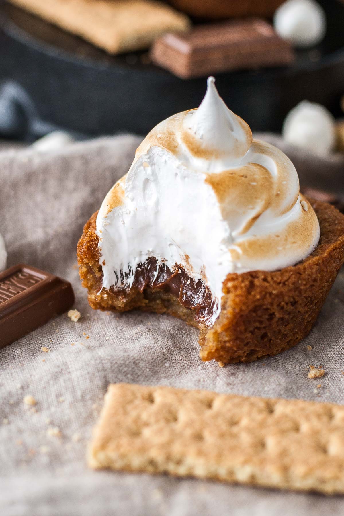 A close up of a cookie cup with a bite taken out