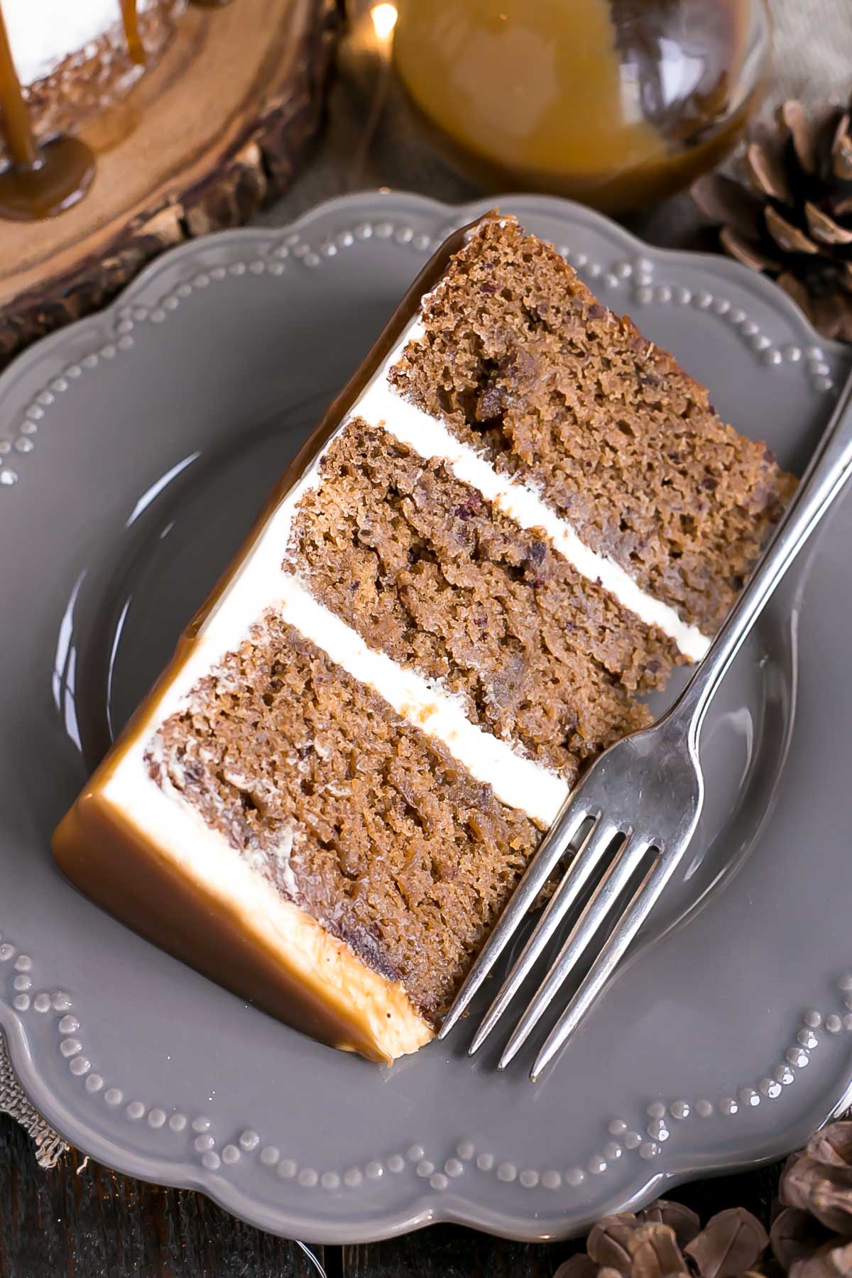 A piece of chocolate cake on a plate with a fork