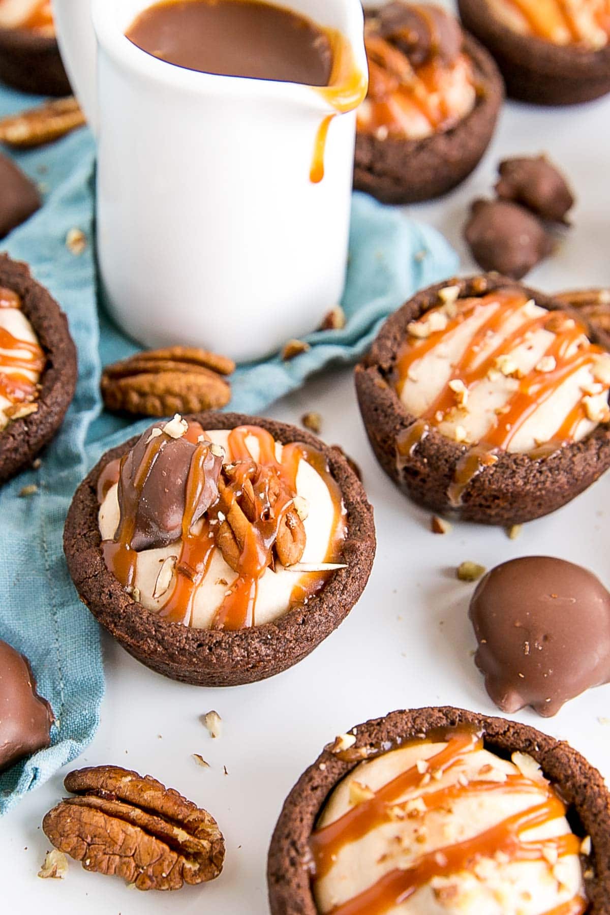 Angled shot of a cookie cup with a Turtle on top.