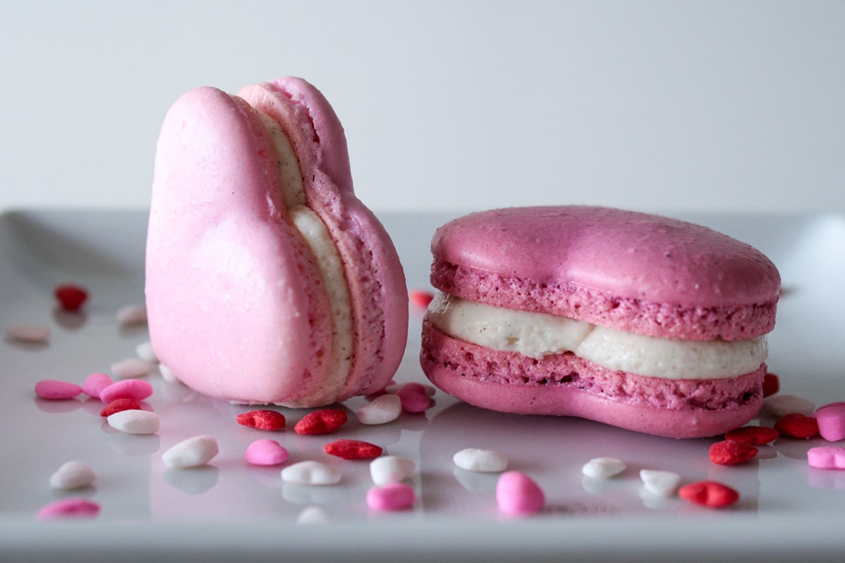 Heart macarons on a plate.