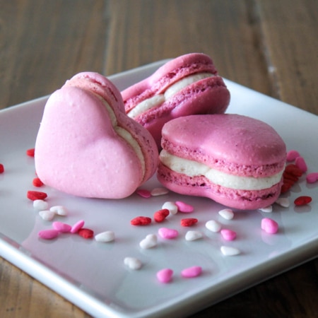 Heart macarons on a plate.